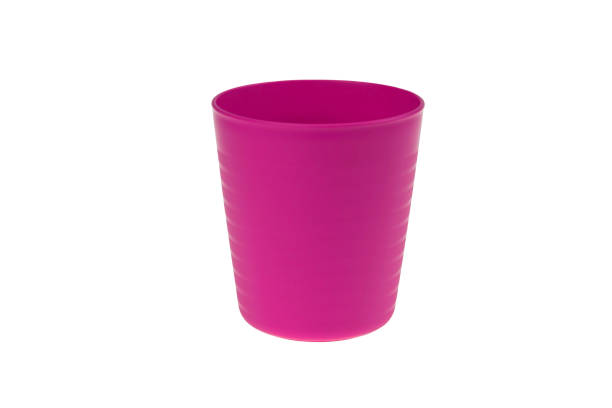 istock Pink plastic glass isolated on white background 1157875250