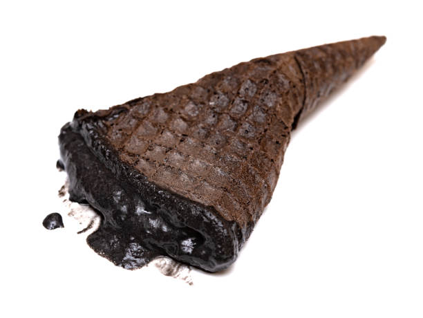 istock black color ice cream cone on white background 1157875423