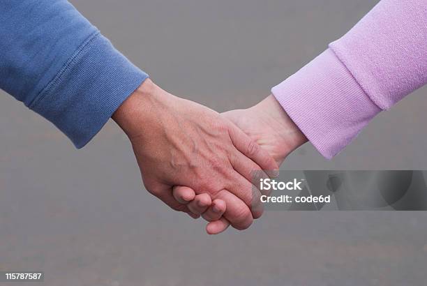 Two Women Mother And Daughter Holding Hands Stock Photo - Download Image Now - 20-24 Years, 45-49 Years, A Helping Hand