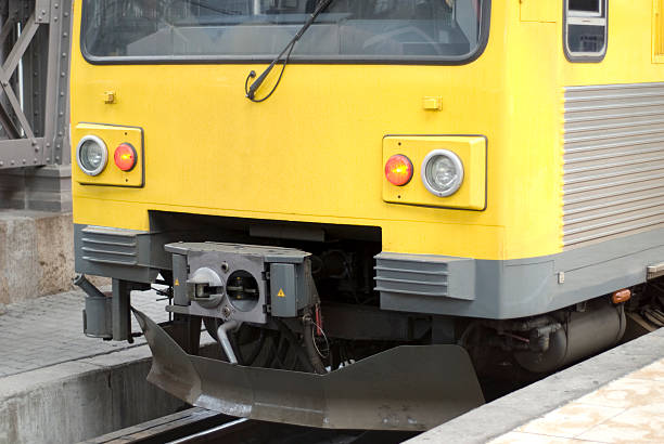 istock Train front of yellow passenger car, station platform 115787756