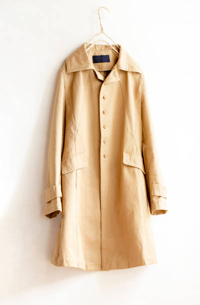 istock Beige elegant trench coat isolated over white 1157879682