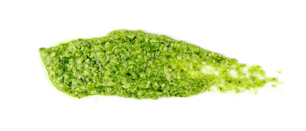 istock Pesto sauce spread or blob isolated on white background 1157884319