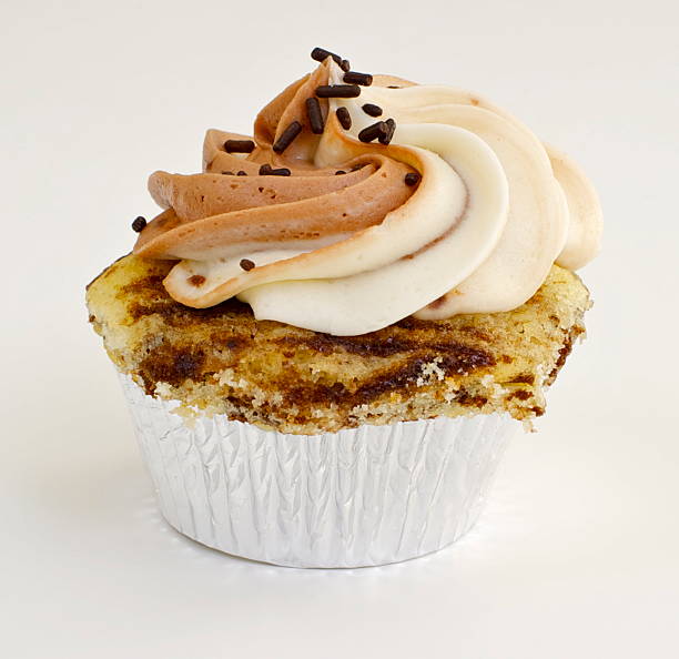 istock Chocolate and Vanilla Cupcake with Butter Cream Swirl 115788701