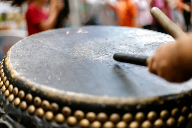istock Close-up macro of a drumhead while hands hit it 1157894994