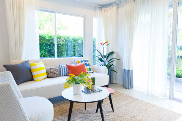 istock Colourful pillow on white sofa in modern and eclectic style living room. 1157898148