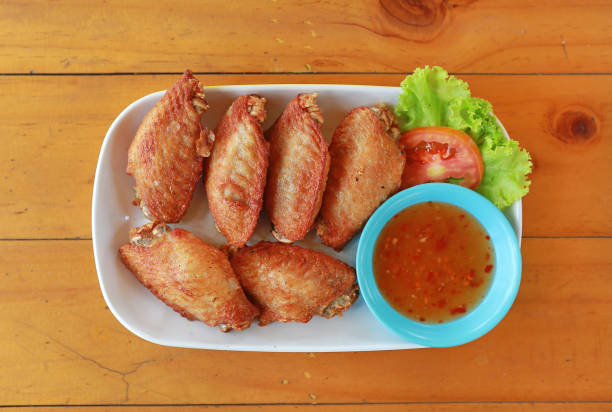 istock buffalo chicken wings with sweet chilli sauce on white plate 1157898267