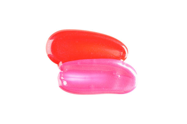 Lip gloss isolated on white background. Makeup products