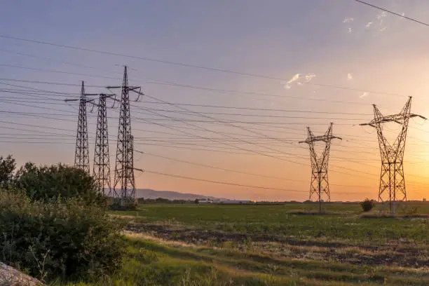 Amazing sunset Landscape of High-voltage power lines in the land around city of Plovdiv, Bulgaria