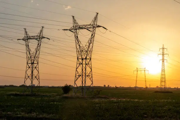 Amazing sunset Landscape of High-voltage power lines in the land around city of Plovdiv, Bulgaria