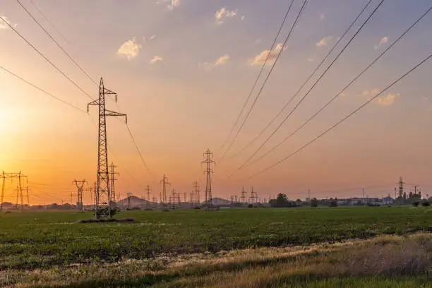 Amazing sunset Landscape of High-voltage power lines in the land around city of Plovdiv, Bulgaria