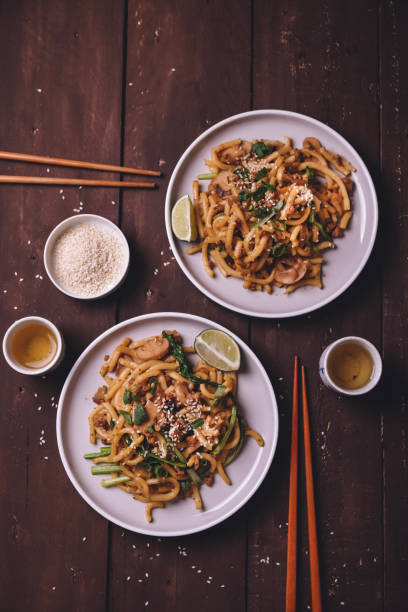 istock Two japaense udon stir fry with vegetable and sesame 1157900312