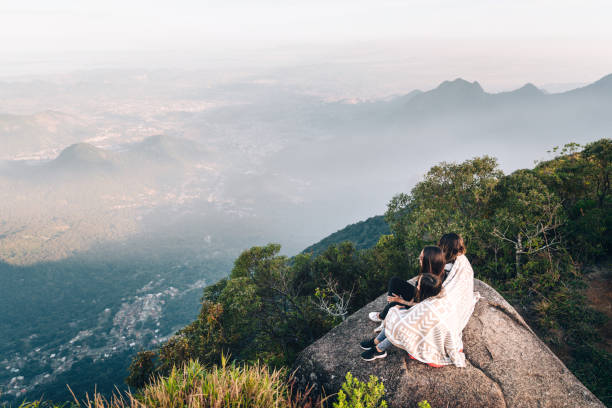 istock Three young friends enjoying the view from the mountain 1157901251