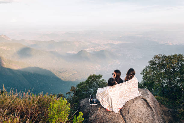 istock Three young friends enjoying the view from the mountain 1157901272