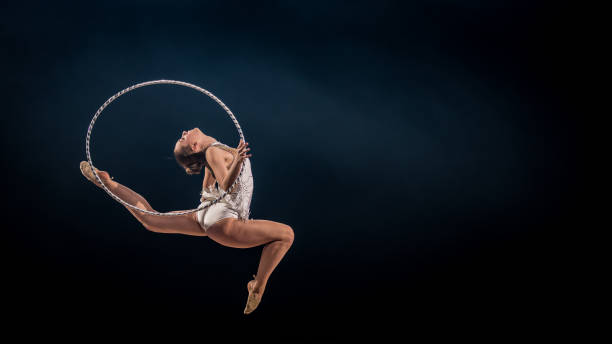 istock Gymnast doing rhythmic gymnastics with hoop 1157901648