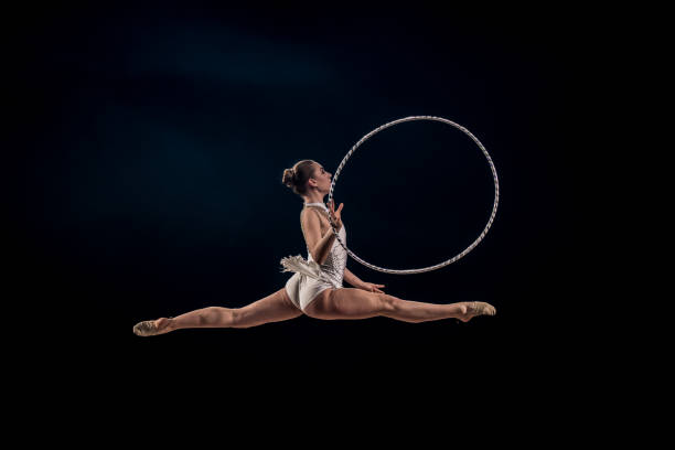 istock Gymnast doing rhythmic gymnastics with hoop 1157901662