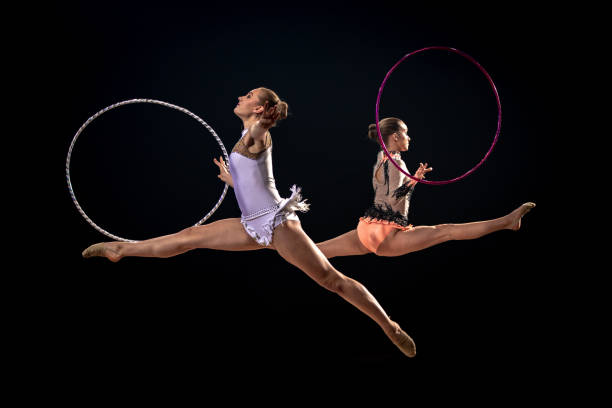 istock Gymnasts doing rhythmic gymnastics with hoop 1157901667