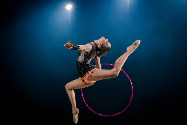 istock Gymnast doing rhythmic gymnastics with hoop 1157901675
