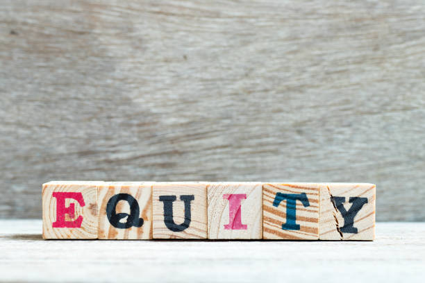 istock Letter block in word equity on wood background 1157903050