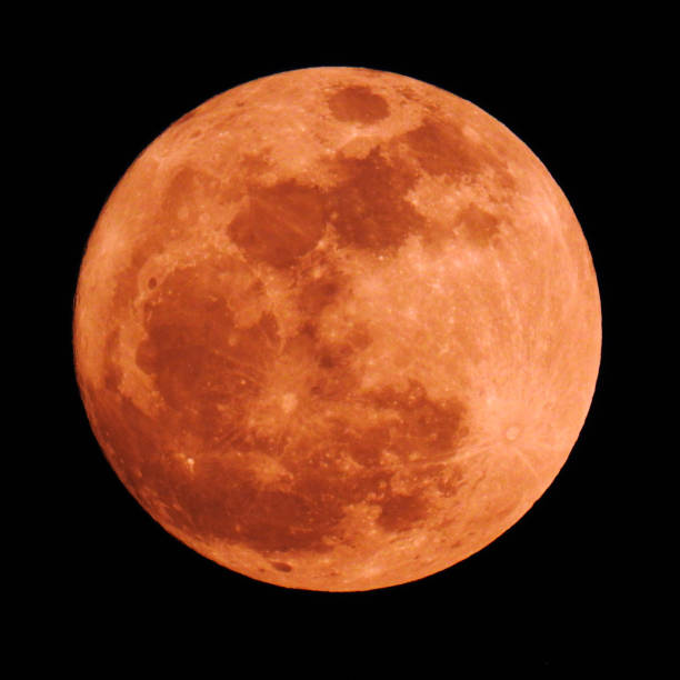istock The moon shines on a black background. 1157903702