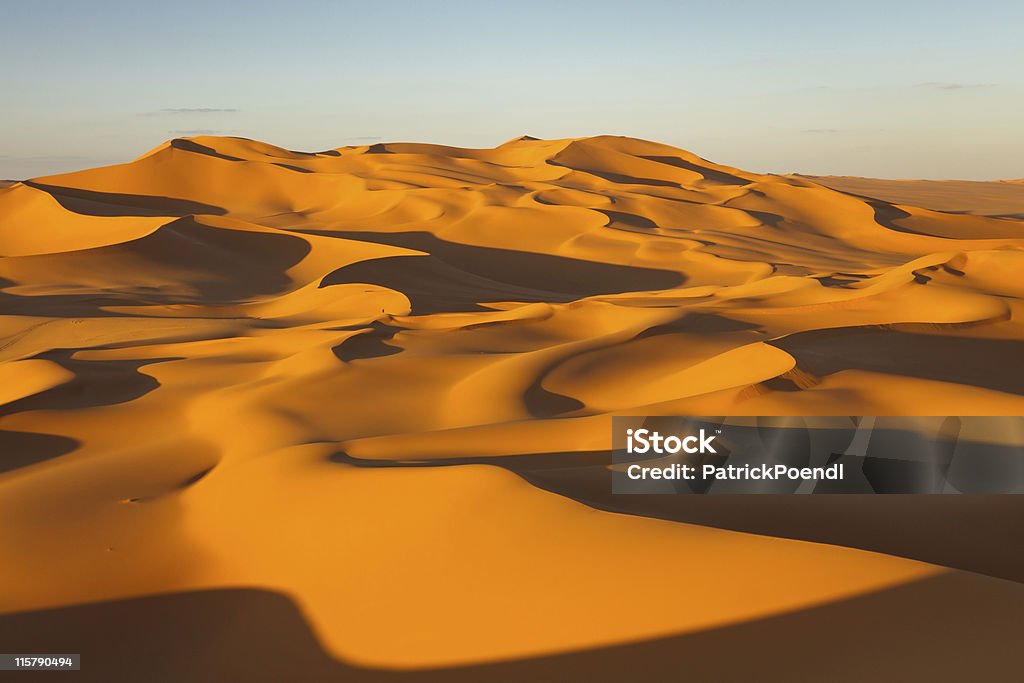 Sand Dunes - Murzuq Desert, Sahara, Libya Endless sand dunes at sunset - Murzuq Desert, Sahara, Libya Sahara Desert Stock Photo