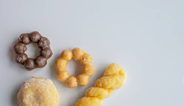 istock closeup donut on white table with soft-focus in the background. over light 01 1157905128