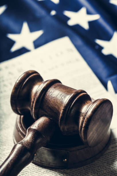 istock Wooden gavel and USA flag 1157905384