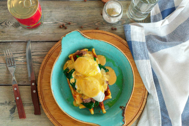 istock Savory belgian waffles with salad and poached egg 1157910587