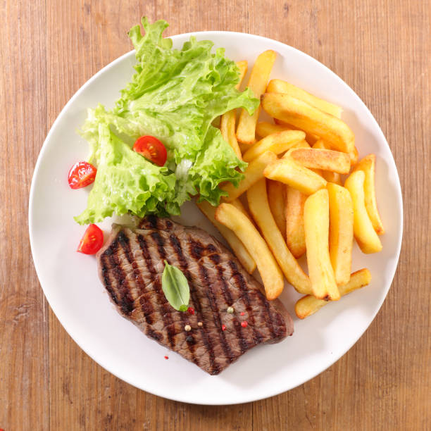 istock fried beef with lettuce and french fries 1157910681