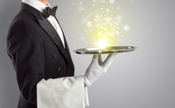 istock Waiter serving mysterious light on tray 1157910860