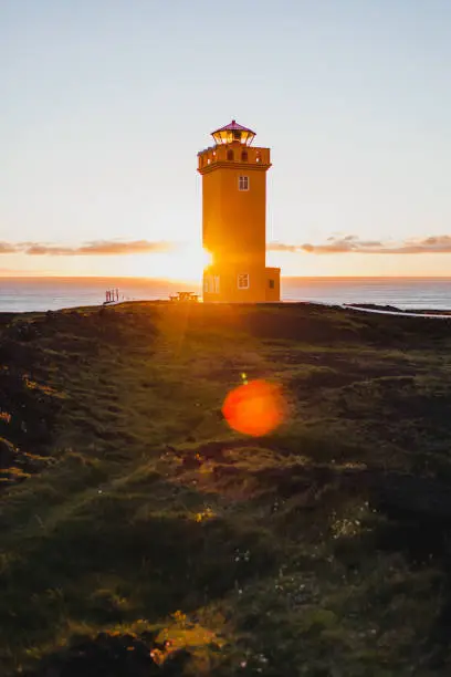 Photo of Svortuloft Lighthouse, Hellissandur in The Snaefellsjokull National Park, Snaefellsbaer, Iceland. Orange colorful sunset, good sunny weather.