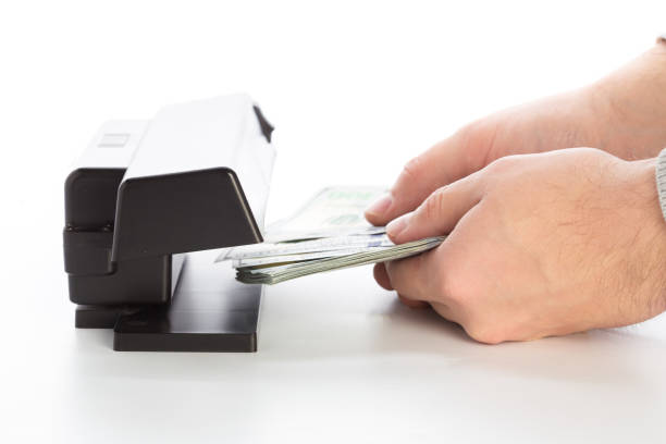istock money checker isolated on white 1157914298