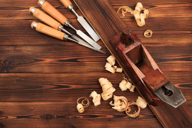istock chisels plane and sawdust on a wooden table - Image 1157915462