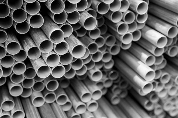 steel electric conduit pipes stack of steel electric conduit pipes, black and white tone, selective focus, industry concept background canal stock pictures, royalty-free photos & images
