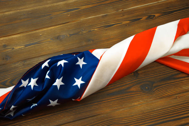 istock American flag on a old wooden desk top view - Image 1157915819