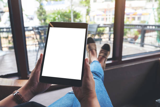 istock a woman holding black tablet pc with blank white screen 1157915846