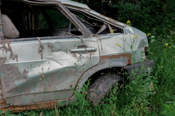 istock the body of a crashed car drowned in mud 1157918865