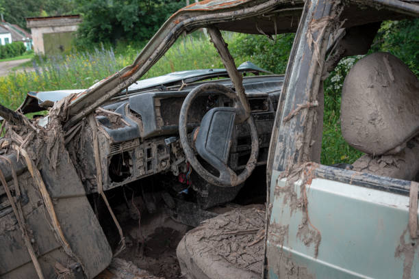istock the body of a crashed car drowned in mud 1157918956