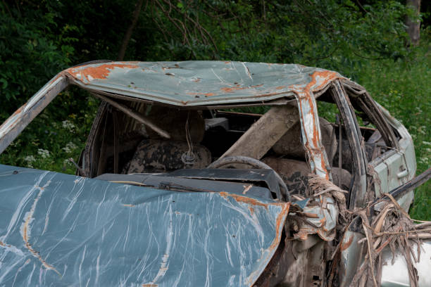 istock the body of a crashed car drowned in mud 1157918960