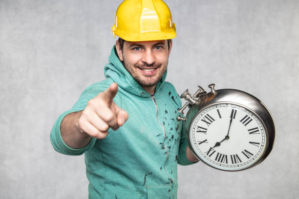istock concept of time in matters of construction, builder and clock 1157919182
