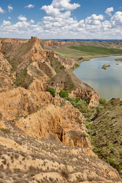 istock Red clay erosion gully and river. Eroded landscape. Spain 1157920126