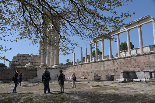 Pergamon, Turkey - April, 28, 2019: tourists visit the rouins of akropolis of Pergamon