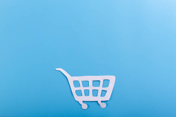 istock shopping trolley on blue background 1157921369