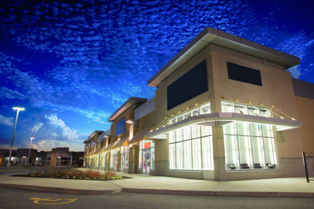 Store Building Exteriors at Sunrise Illuminated Store Building early in the Morning window shopping at night stock pictures, royalty-free photos & images