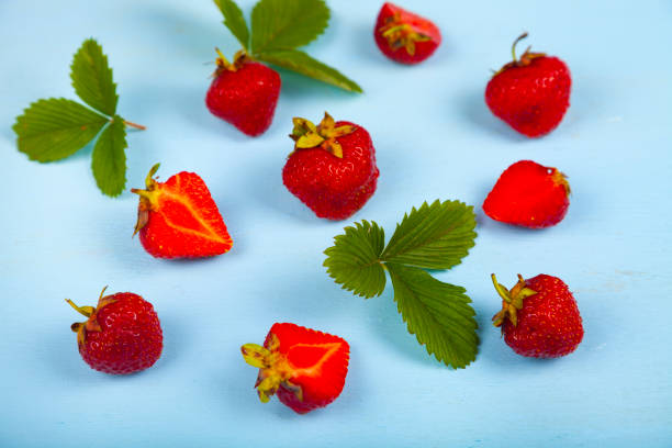 istock Ripe strawberries on a blue table. 1157926804