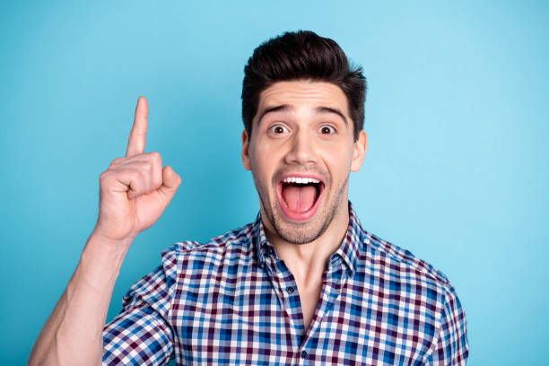 istock Close up photo amazing he him his macho wondered indicate up empty space open mouth index finger tips feedback advising buy buyer wear casual checkered plaid shirt isolated bright blue background 1157928717