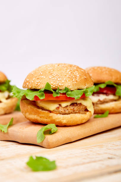 istock Craft beef burger  on wooden table on light background 1157929802