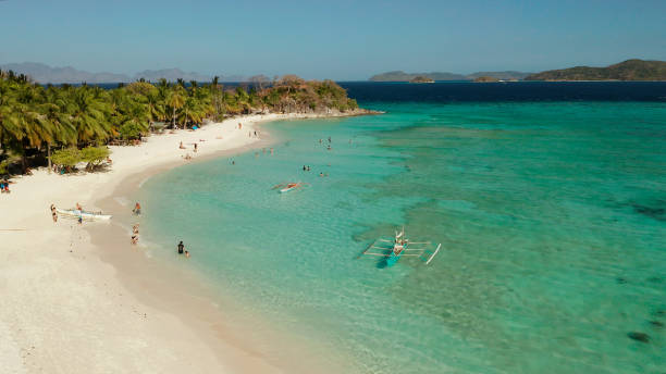 istock torpical island with white sandy beach, top view 1157934736