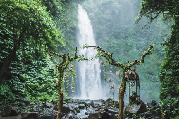 istock Wedding ceremony in Nung-Nung Bali waterfall in rainforest. 1157942077