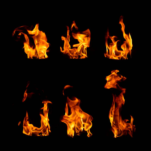 istock Set of fire flames isolated on black 1157942511