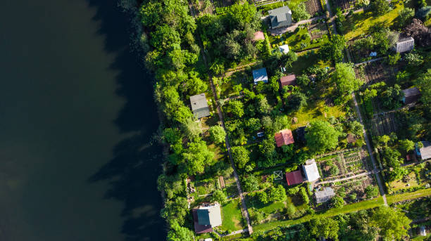 istock Tiny Ecological Friendly City Plot Gardens on Lake Edge, Aerial Top Down View 1157942861